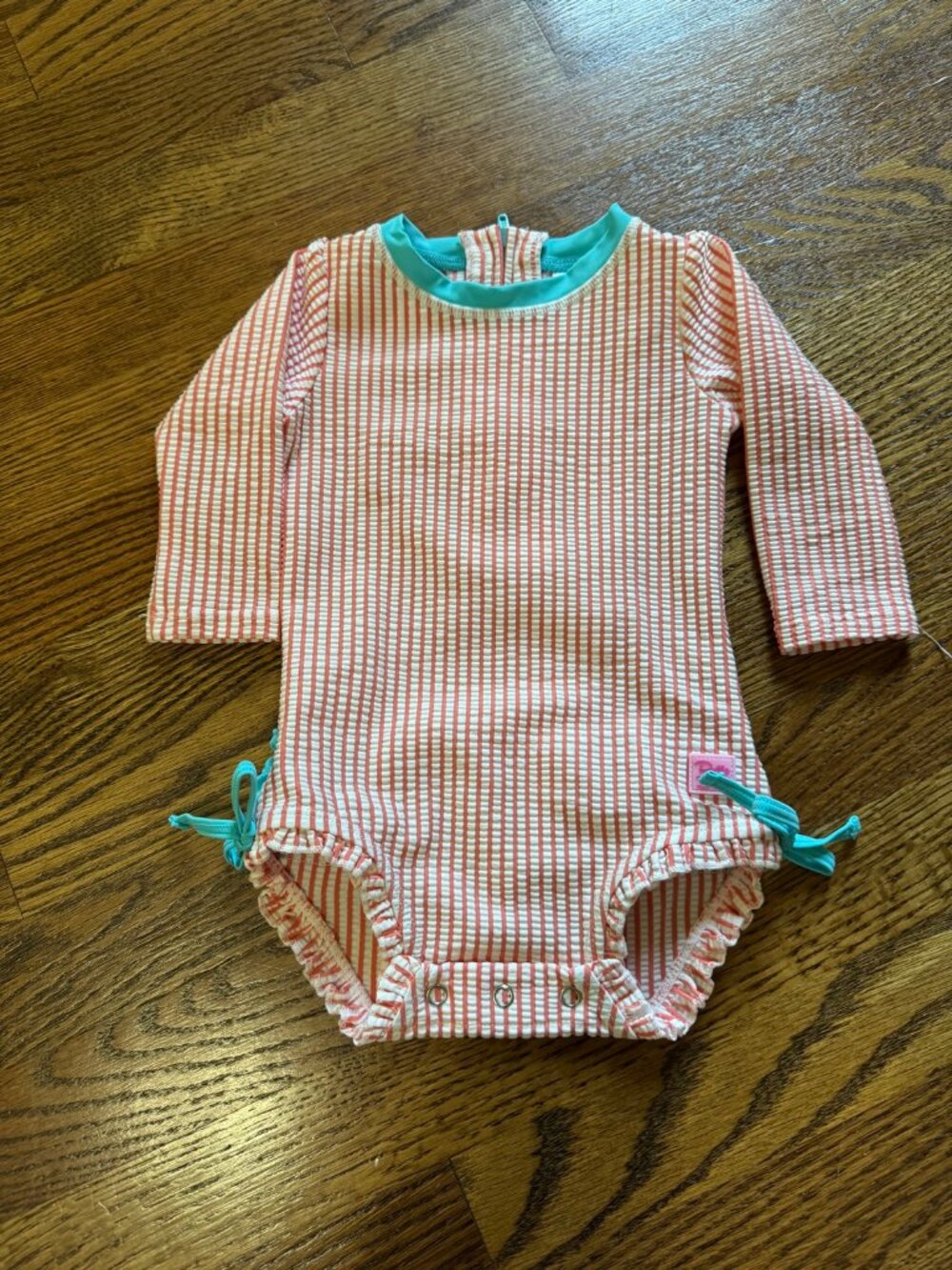 RuffleButts Seersucker Stripe Rash Guard Swimsuit | 6-12M